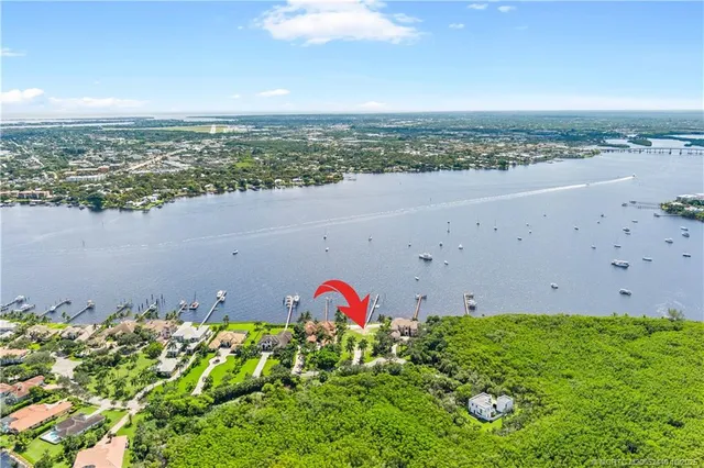 an aerial view of beach and residential houses with outdoor space