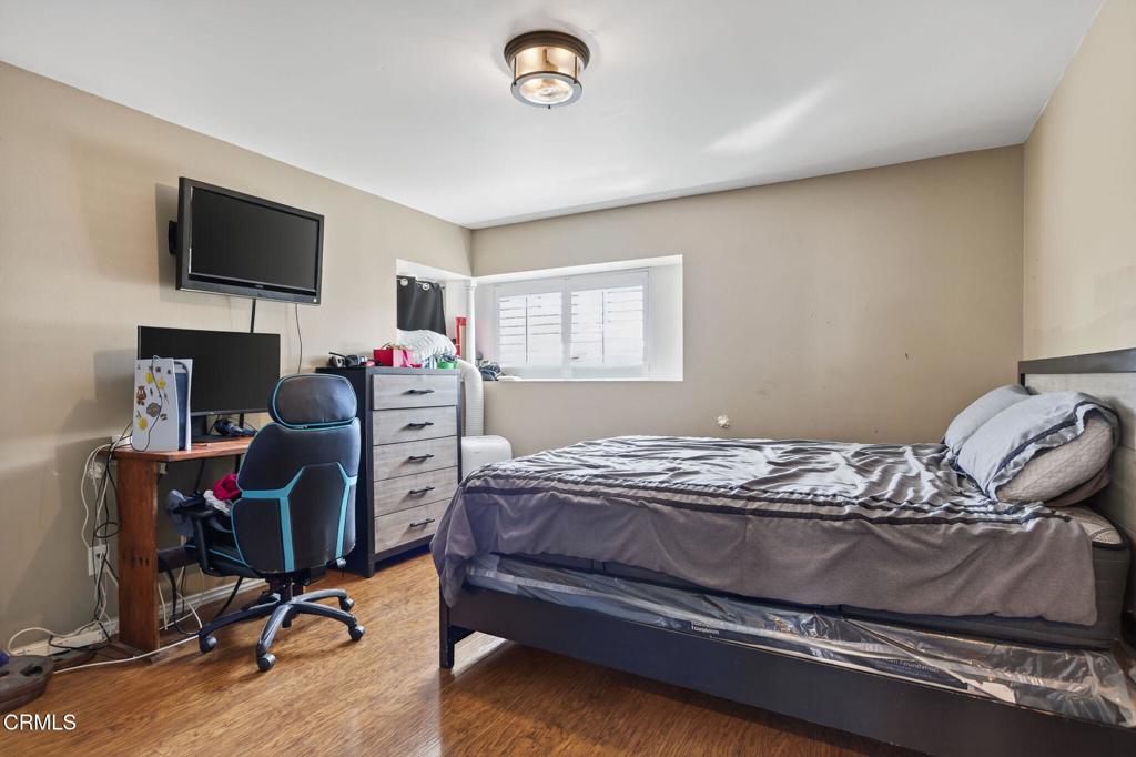 729 Ralph Way Santa Paula, CA 93060 - Photo 20 of 55 a bedroom with a bed and a flat screen tv