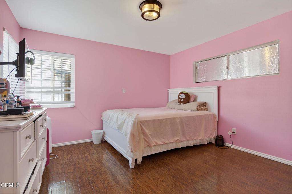 729 Ralph Way Santa Paula, CA 93060 - Photo 23 of 55 a bedroom with a bed and a window
