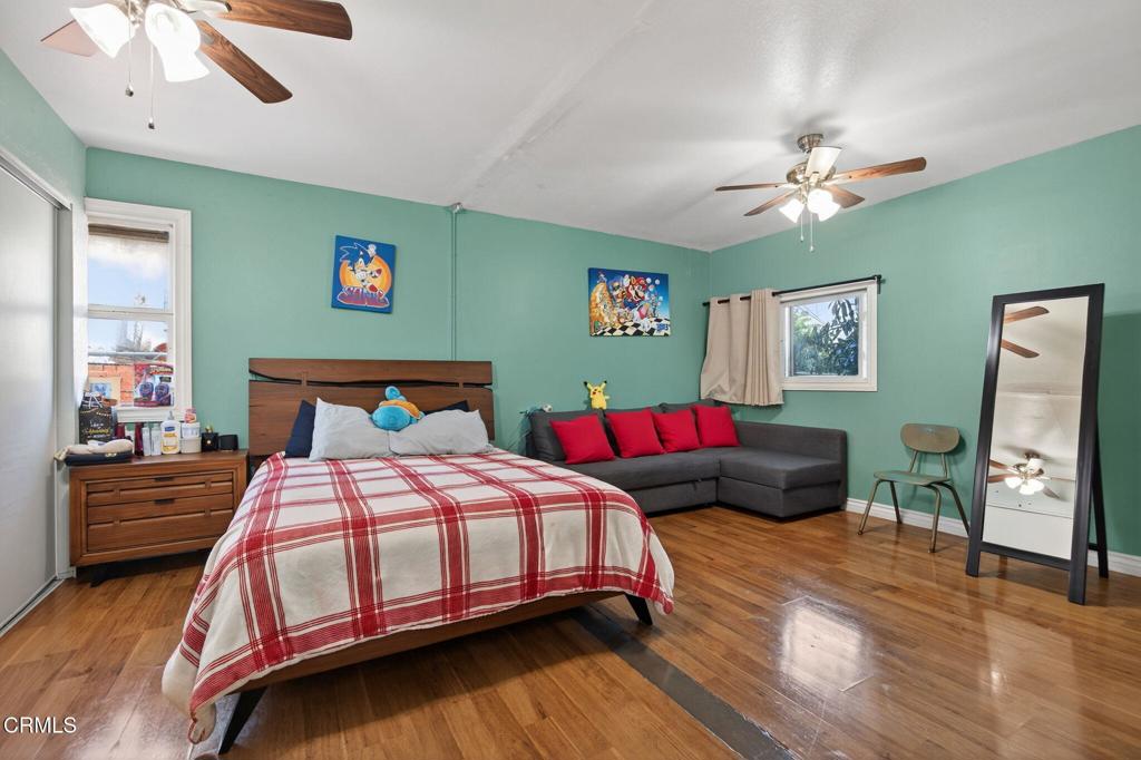 729 Ralph Way Santa Paula, CA 93060 - Photo 28 of 55 a bedroom with bed and wooden floor