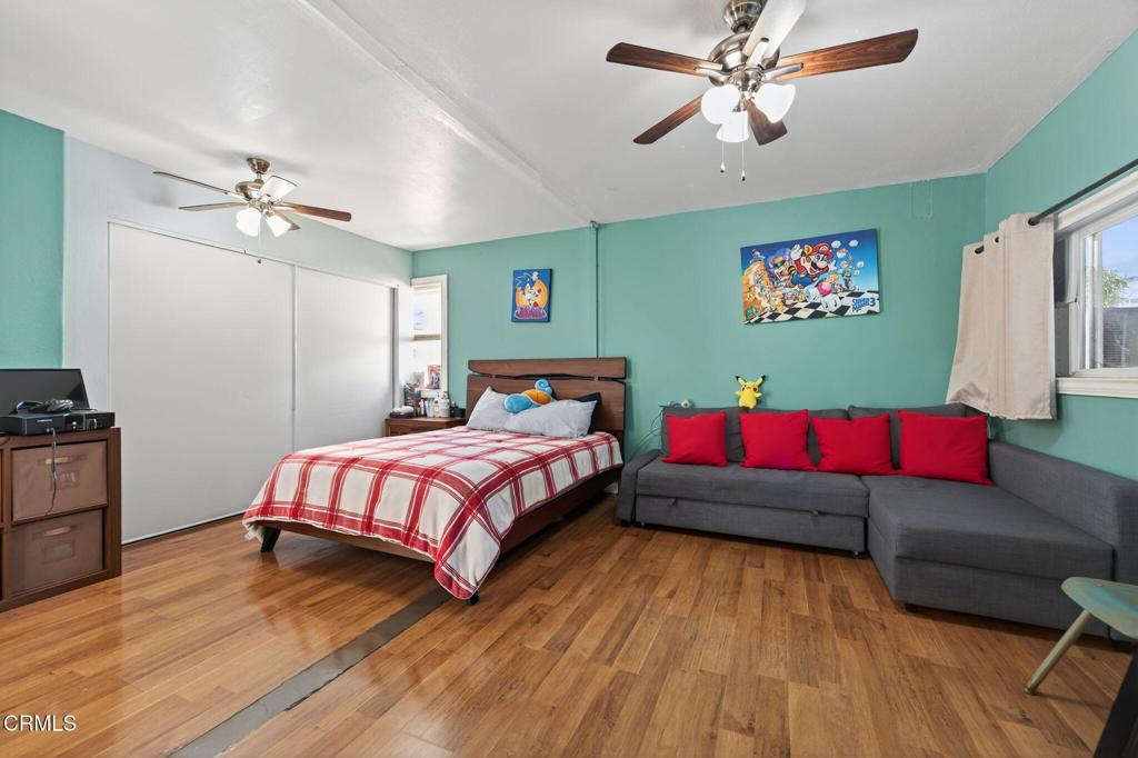 729 Ralph Way Santa Paula, CA 93060 - Photo 29 of 55 a bedroom with a bed and a chandelier