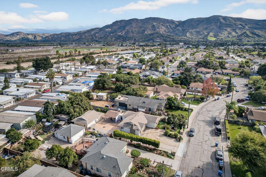 729 Ralph Way Santa Paula, CA 93060 - Photo 50 of 55 an aerial view of a city with lots of residential buildings and mountain view in back
