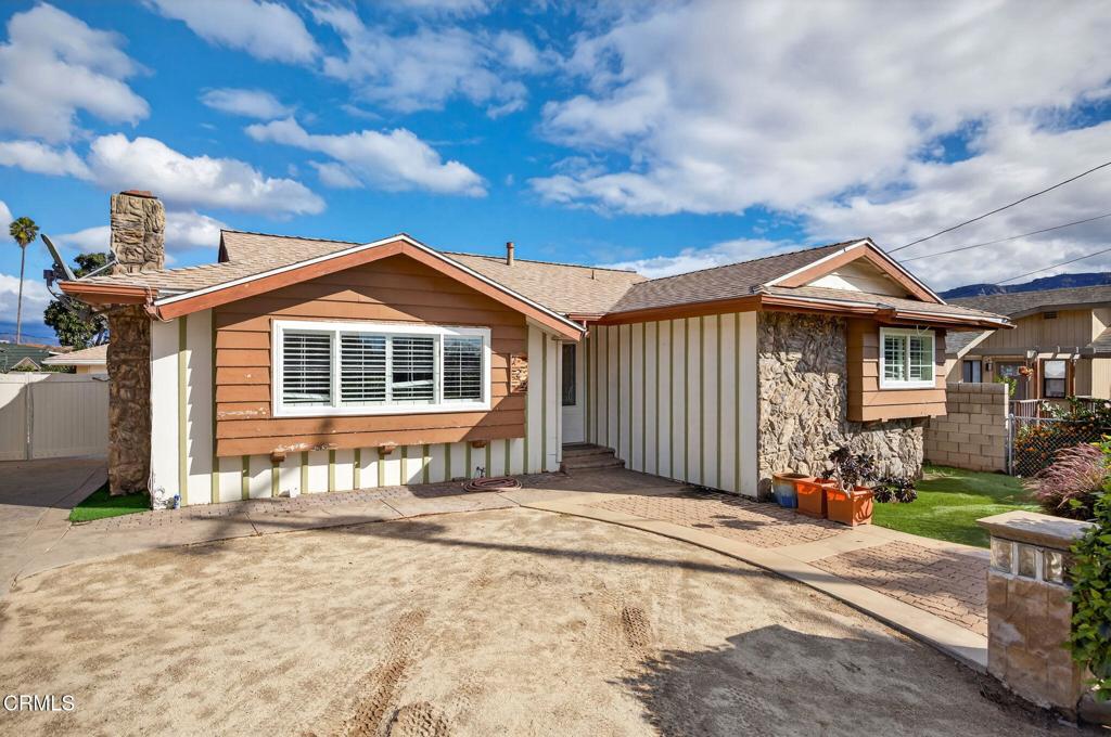 729 Ralph Way Santa Paula, CA 93060 - Photo 5 of 55 a front view of a house with a yard
