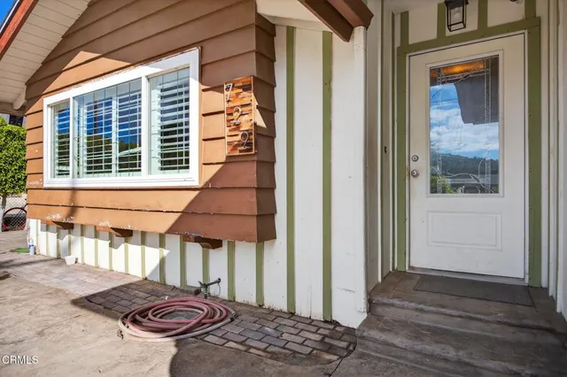 a view of a door and a window