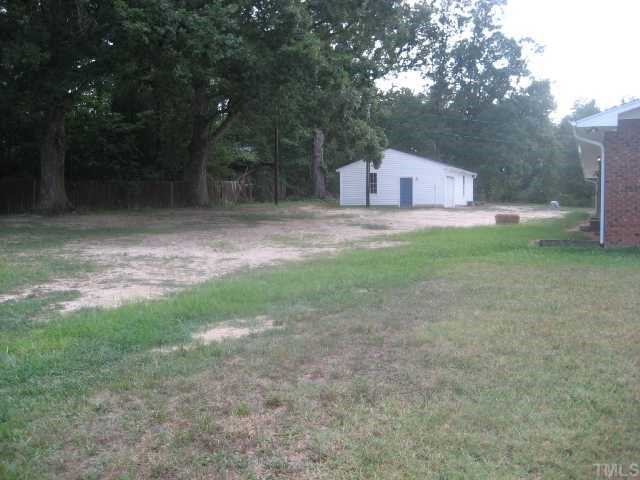 4208 Old Milburnie Road Raleigh, NC 27616 - Photo 2 of 12 a backyard of a house with table and chairs
