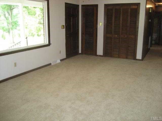 4208 Old Milburnie Road Raleigh, NC 27616 - Photo 3 of 12 an empty room with windows
