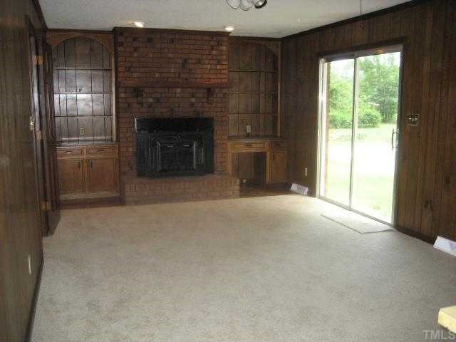 4208 Old Milburnie Road Raleigh, NC 27616 - Photo 7 of 12 a view of empty room with a fireplace