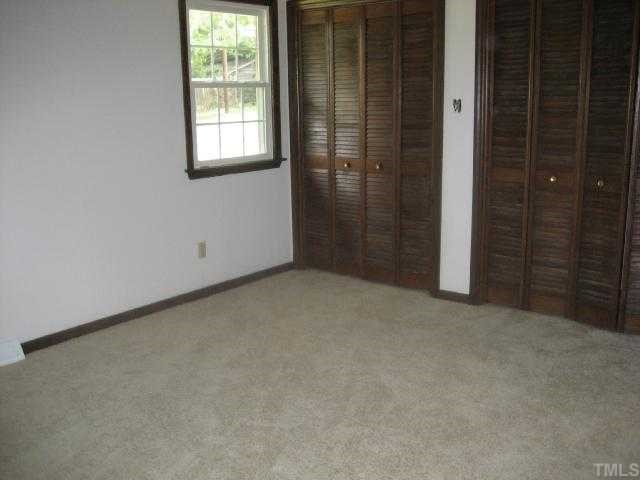4208 Old Milburnie Road Raleigh, NC 27616 - Photo 9 of 12 an empty room with windows