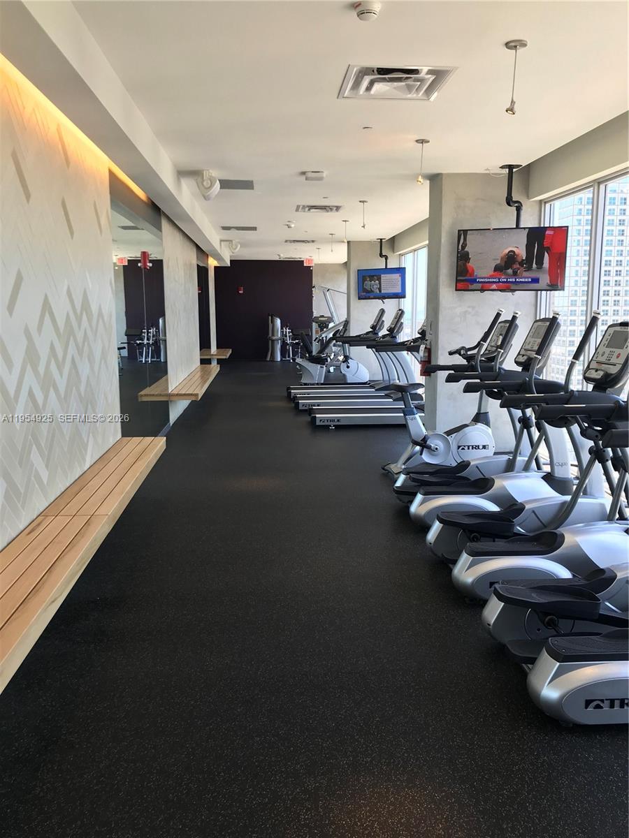 151 Southeast 1st Street, Unit 904 Miami, FL 33131 - Photo 19 of 34 a view of a room with gym equipment