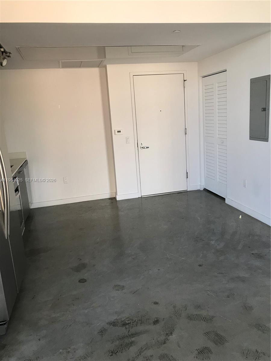 151 Southeast 1st Street, Unit 904 Miami, FL 33131 - Photo 7 of 34 an empty room with wooden floor