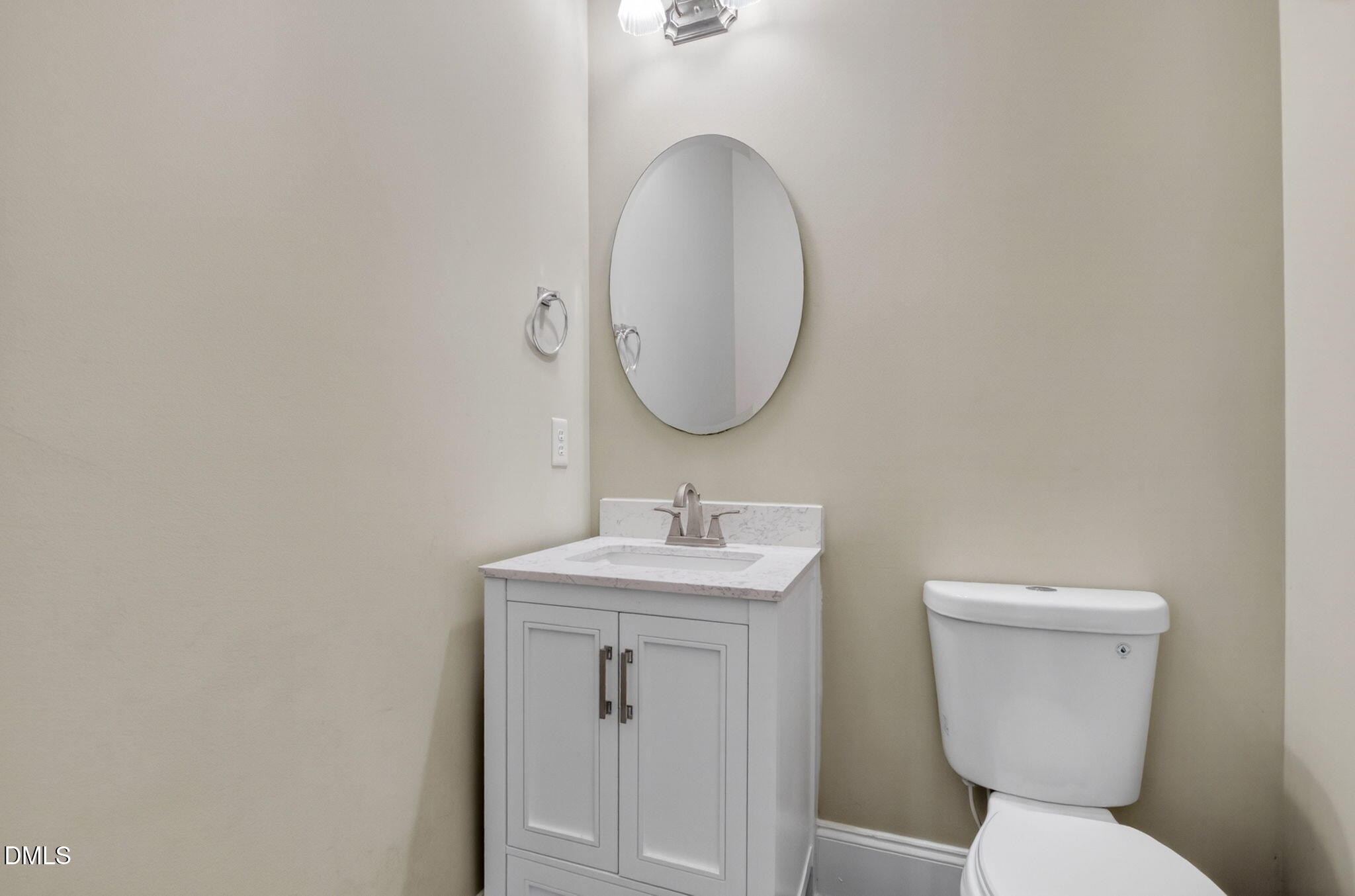 59 Ariel Court Garner, NC 27529 - Photo 19 of 36 a bathroom with a toilet sink and mirror