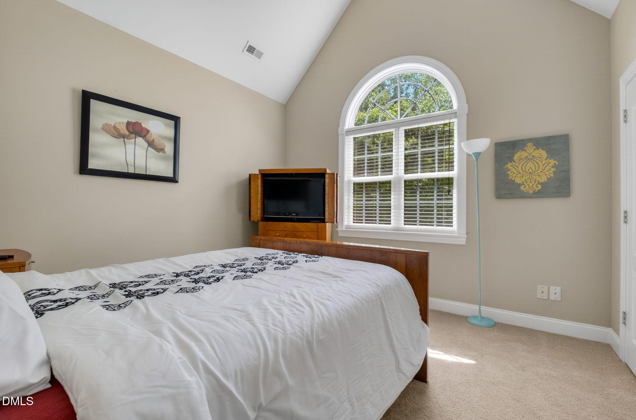 59 Ariel Court Garner, NC 27529 - Photo 29 of 36 a bedroom with a bed and a window