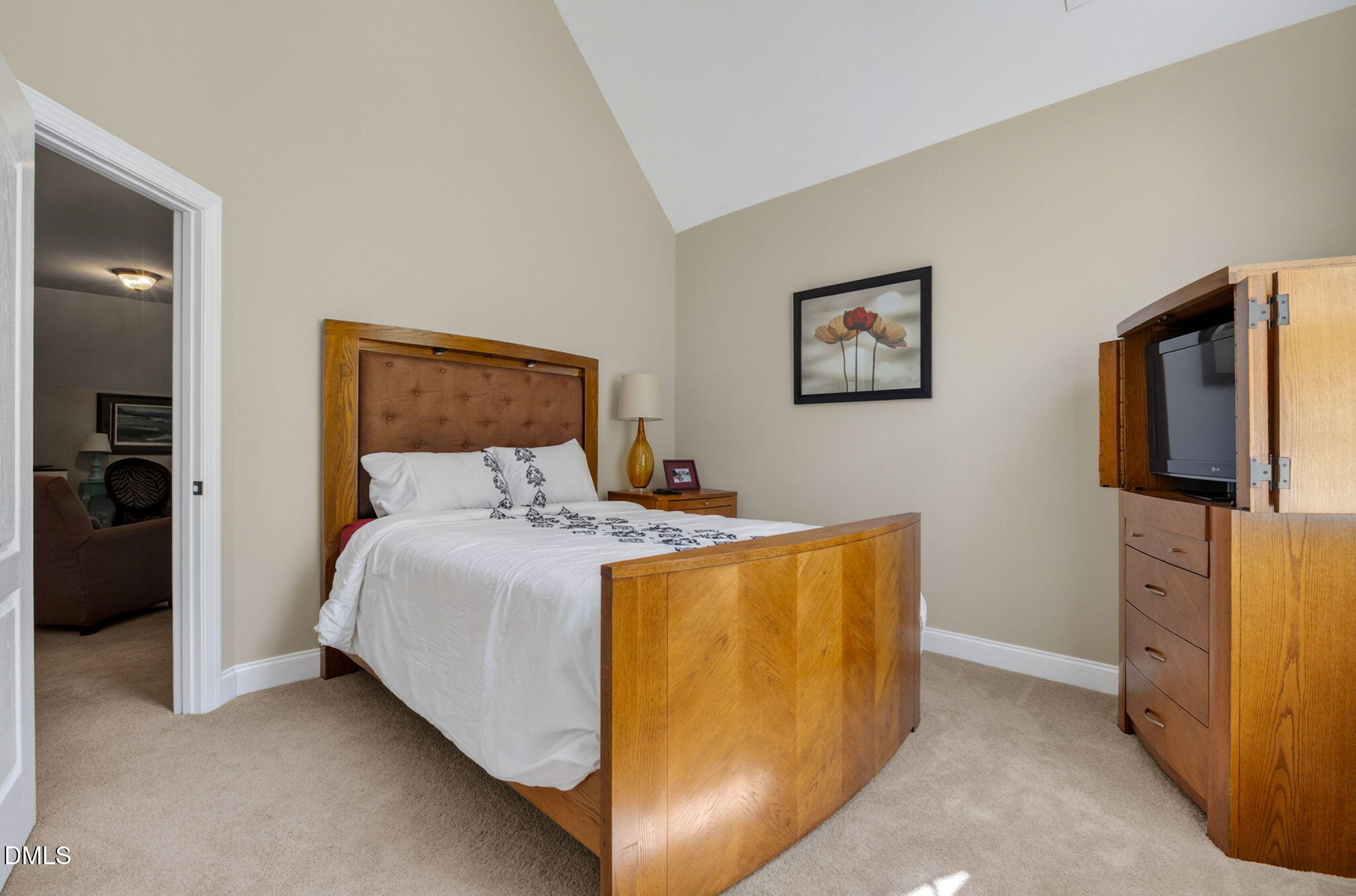 59 Ariel Court Garner, NC 27529 - Photo 30 of 36 a bed room with a bed and a television