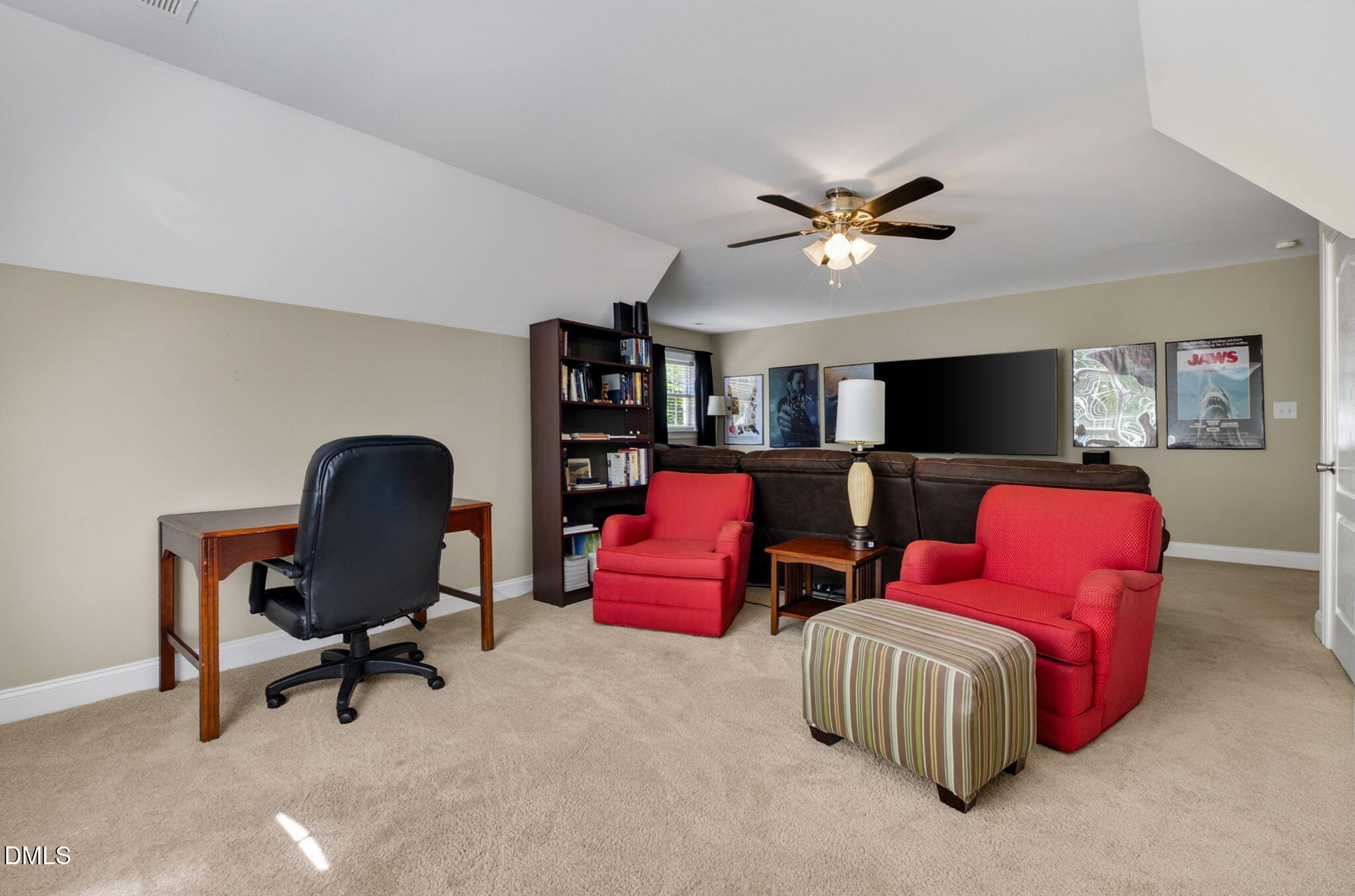 59 Ariel Court Garner, NC 27529 - Photo 32 of 36 a living room with furniture and a flat screen tv