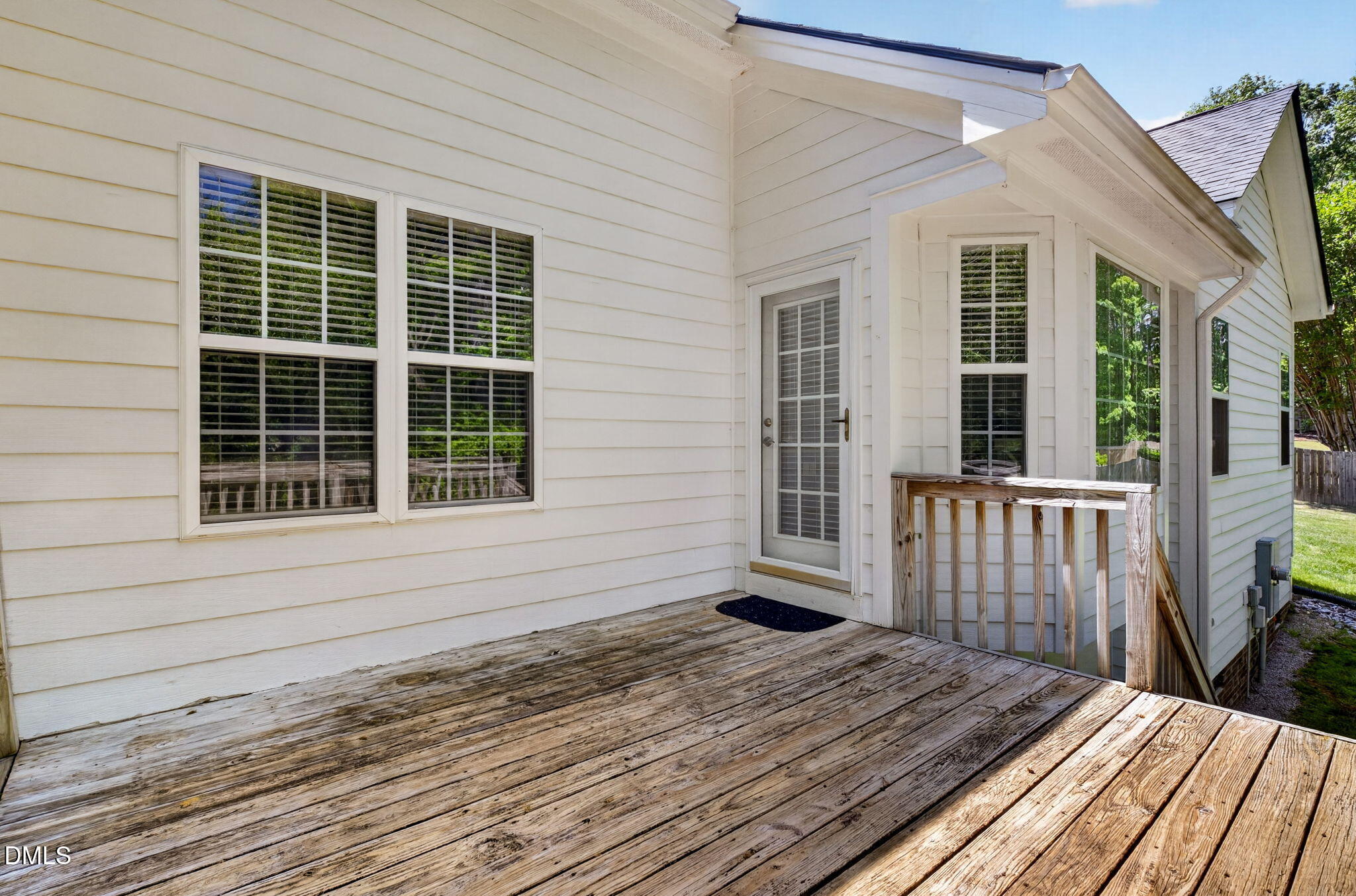 59 Ariel Court Garner, NC 27529 - Photo 34 of 36 a view of a house with a wooden deck