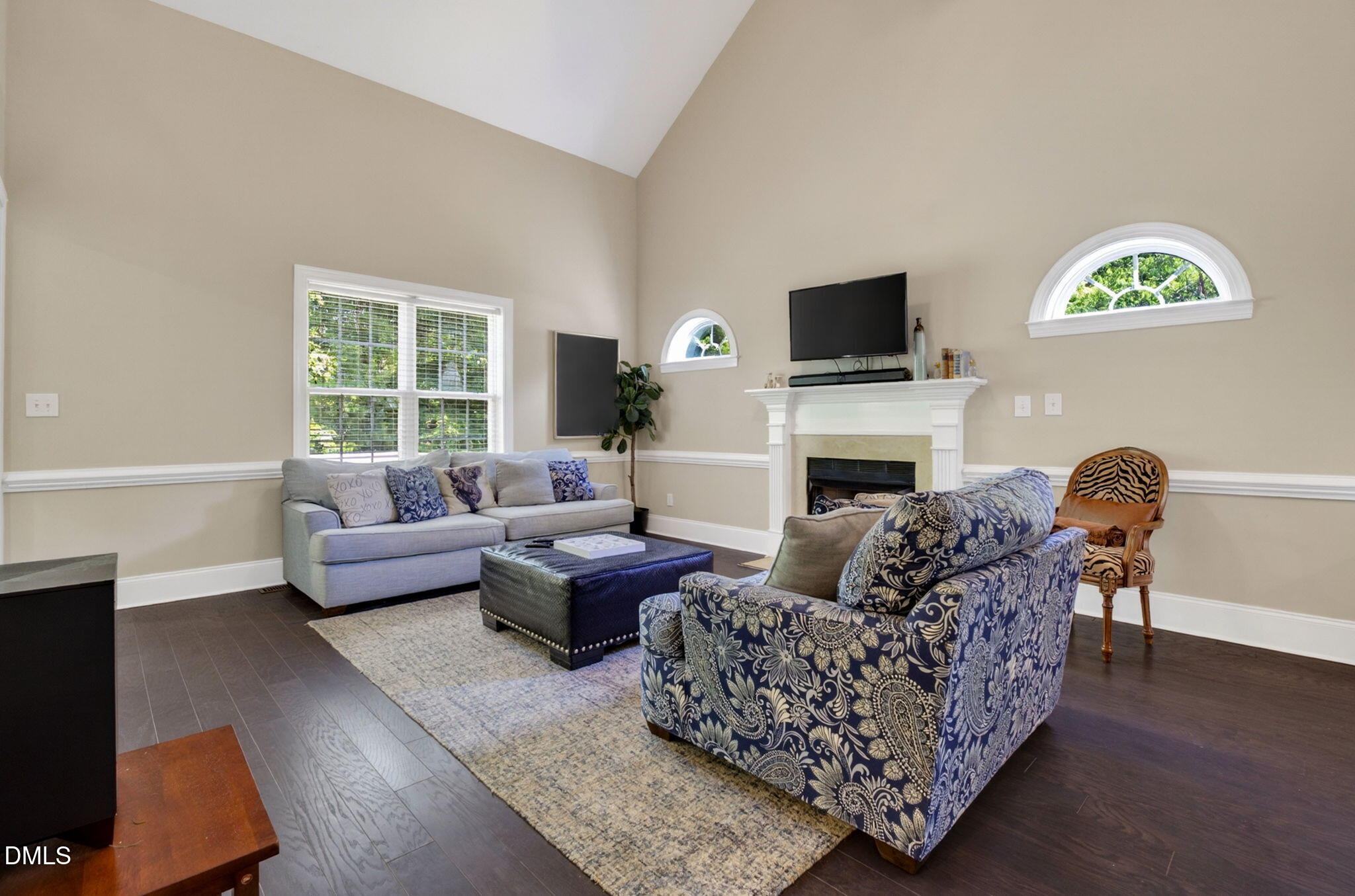 59 Ariel Court Garner, NC 27529 - Photo 9 of 36 a living room with furniture fireplace and a flat screen tv