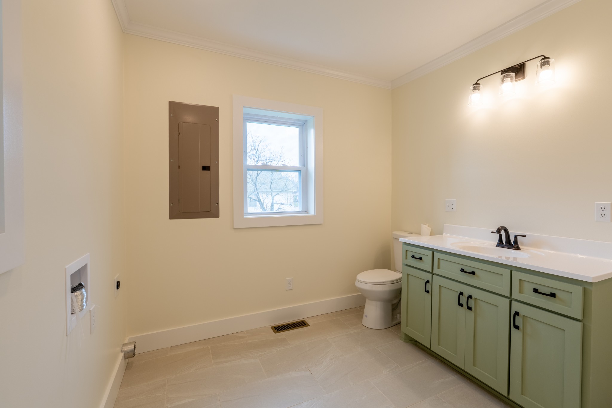 402 West Commerce Street Loretto, TN 38469 - Photo 15 of 23 a bathroom with a toilet sink and mirror