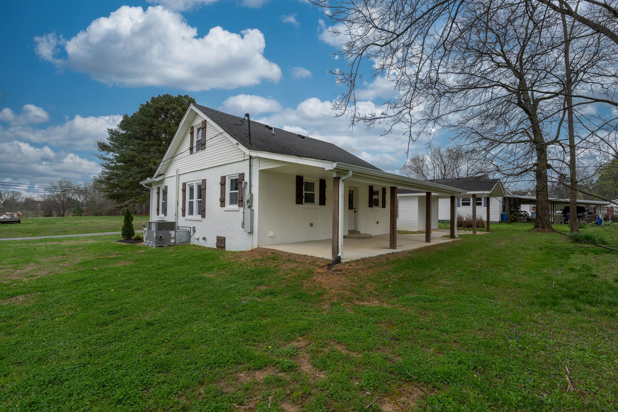 402 West Commerce Street Loretto, TN 38469 - Photo 22 of 23 a view of a house with a backyard