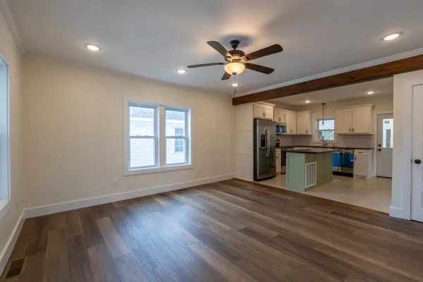 a view of a kitchen with a stove cabinets and a wooden floor