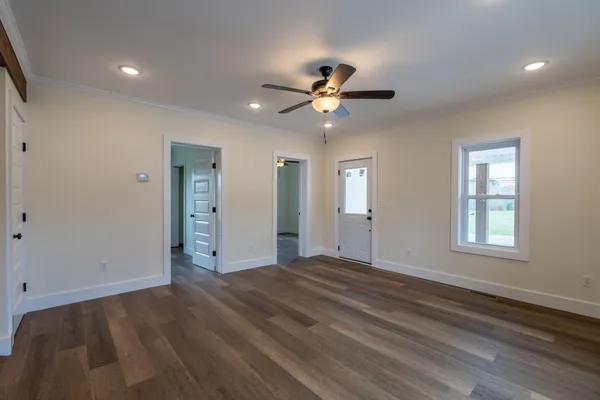a view of an empty room with a window