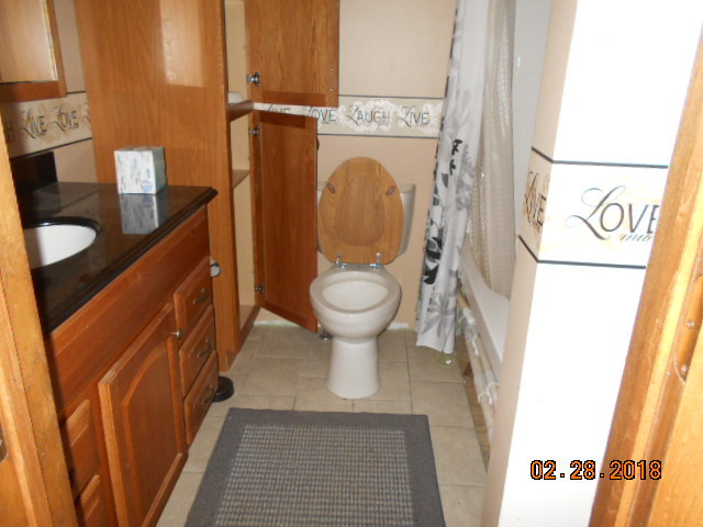 18941 Blue Goose Road Morrison, IL 61270 - Photo 3 of 16 a bathroom with a toilet and a sink