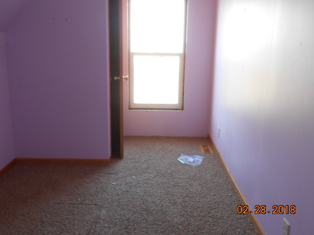 18941 Blue Goose Road Morrison, IL 61270 - Photo 5 of 16 an empty room with a window