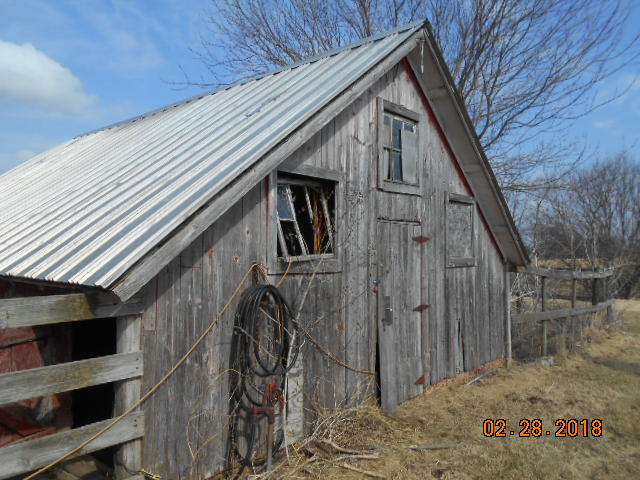 18941 Blue Goose Road Morrison, IL 61270 - Photo 8 of 16 a view of a house with a wooden fence