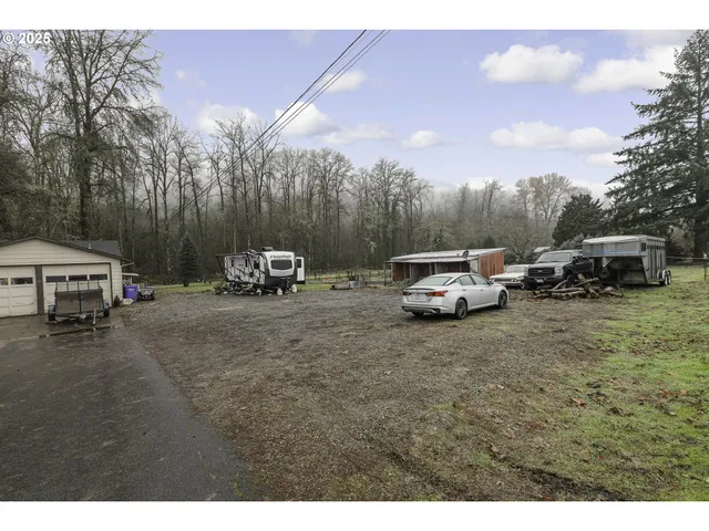 a car parked in front of a white house