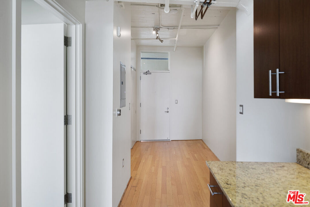 200 North San Fernando Road, Unit 320 Los Angeles, CA 90031 - Photo 8 of 20 a bathroom with a granite countertop sink a toilet and shower