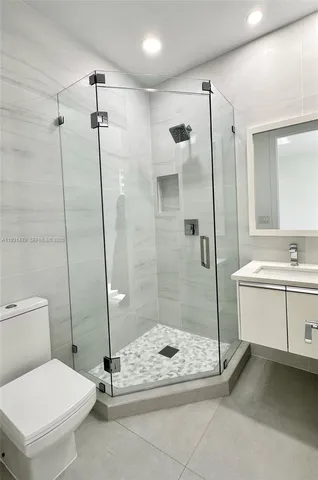 a view of a park with bench and trees