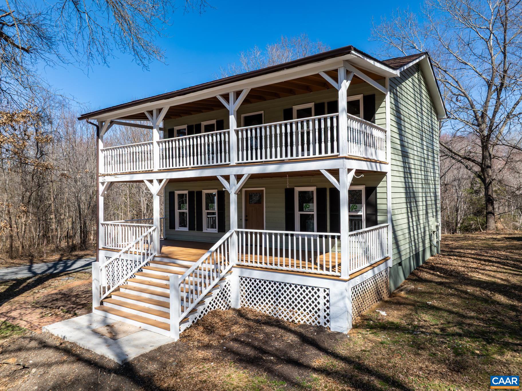 a front view of a house with wooden fence