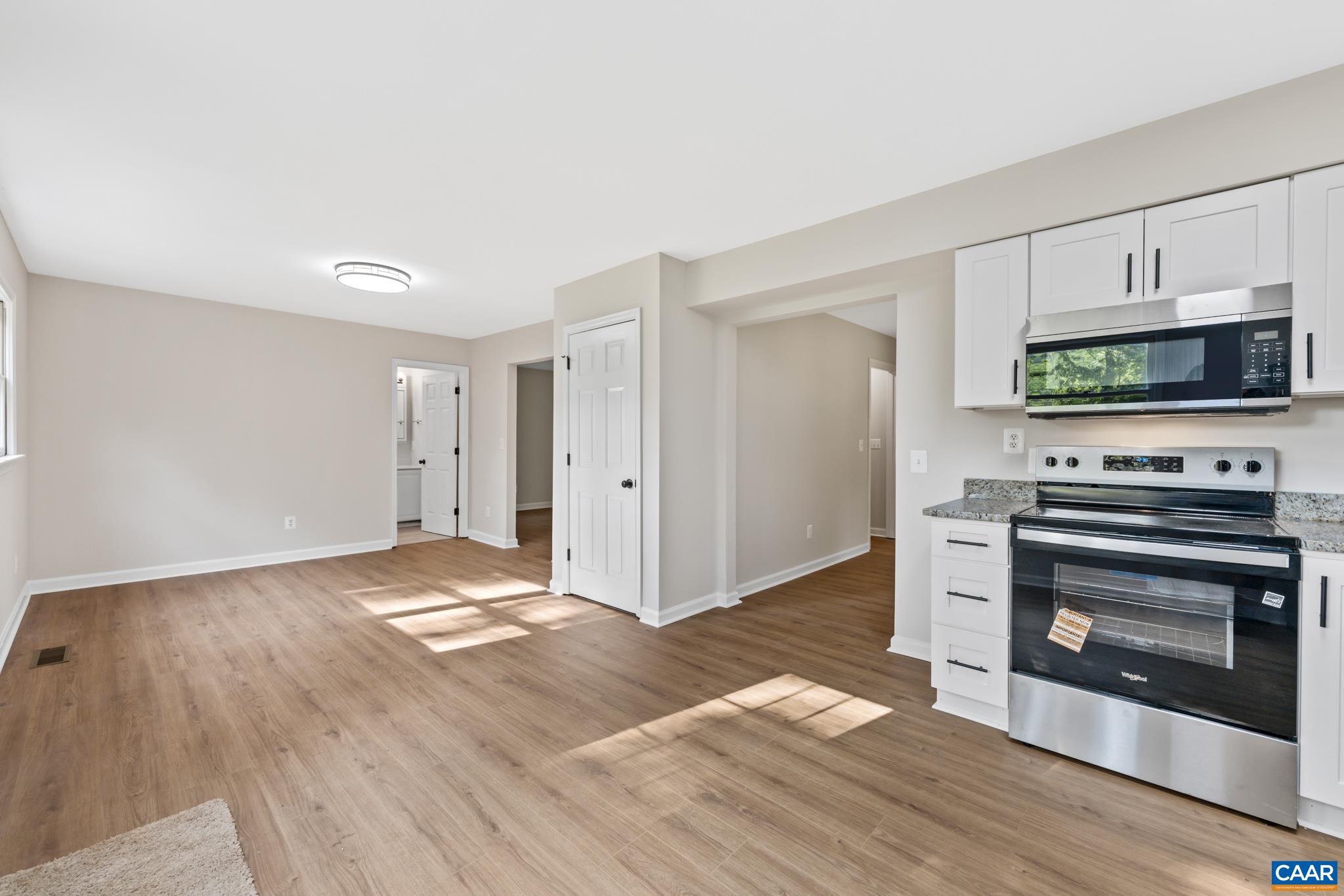 13259 Stonehouse Mountain Road Culpeper, VA 22701 - Photo 11 of 31 a view of kitchen with microwave and stove