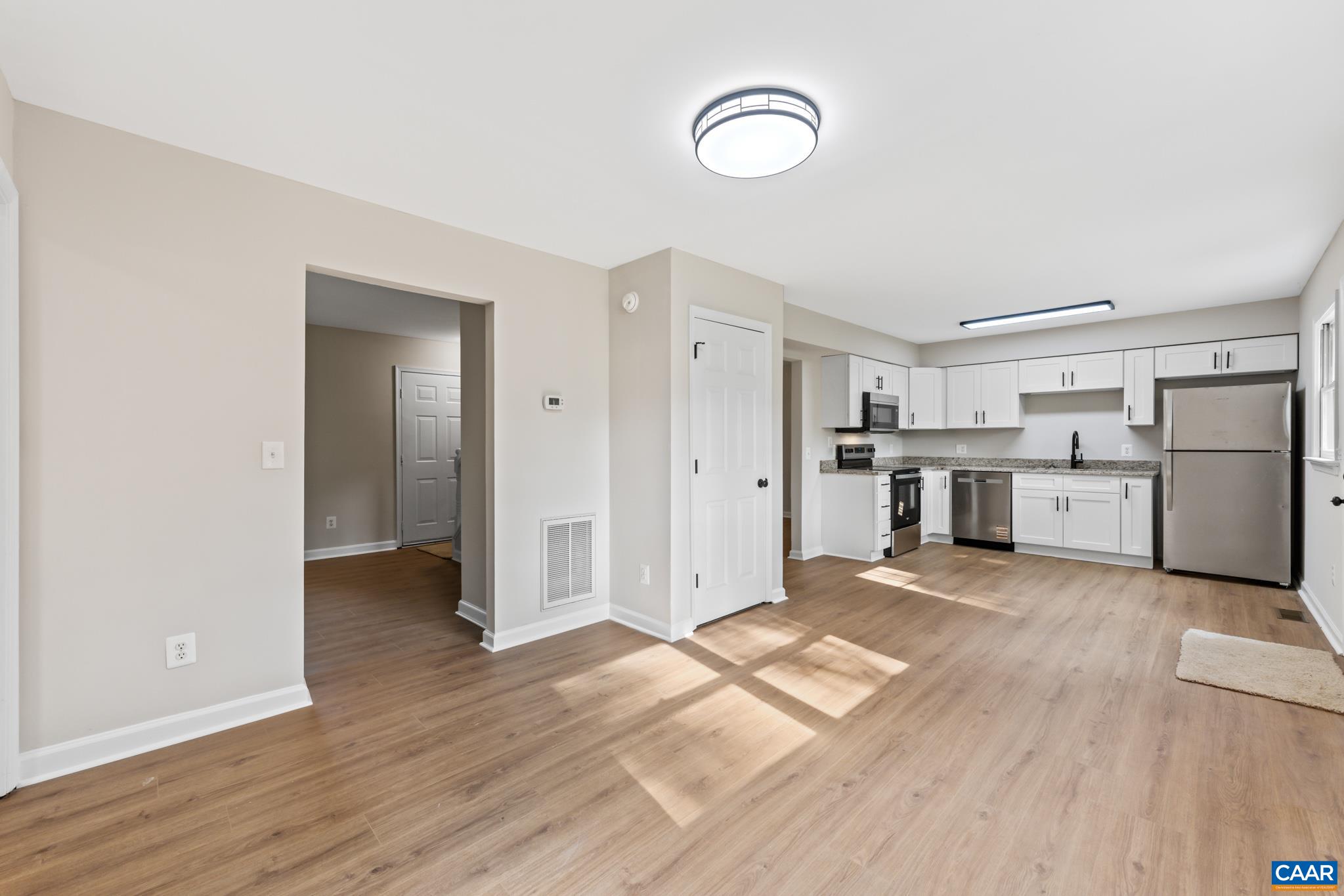 13259 Stonehouse Mountain Road Culpeper, VA 22701 - Photo 12 of 31 a view of a kitchen with wooden floor and electronic appliances