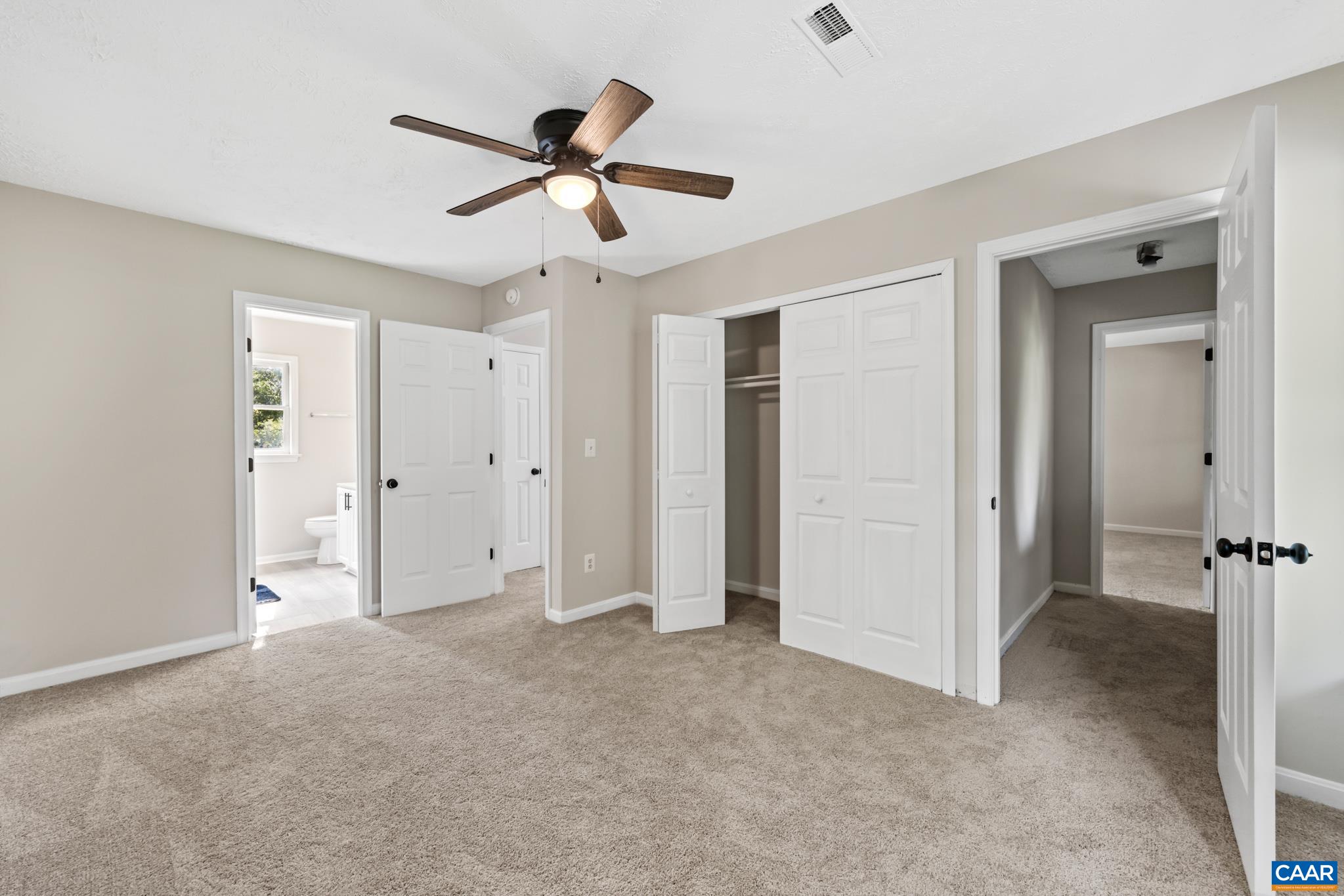 13259 Stonehouse Mountain Road Culpeper, VA 22701 - Photo 16 of 31 a view of a livingroom with a ceiling fan & entryway
