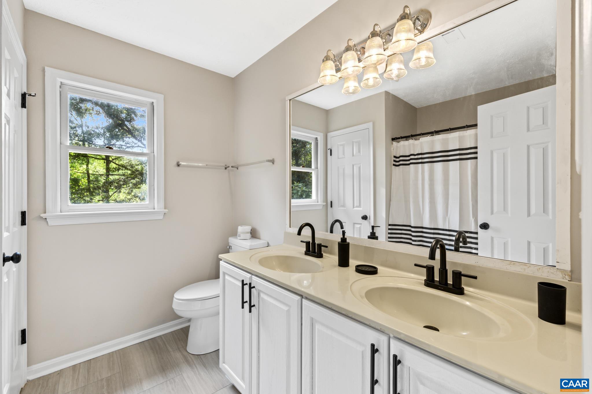 13259 Stonehouse Mountain Road Culpeper, VA 22701 - Photo 17 of 31 a bathroom with 2 sink and a mirror