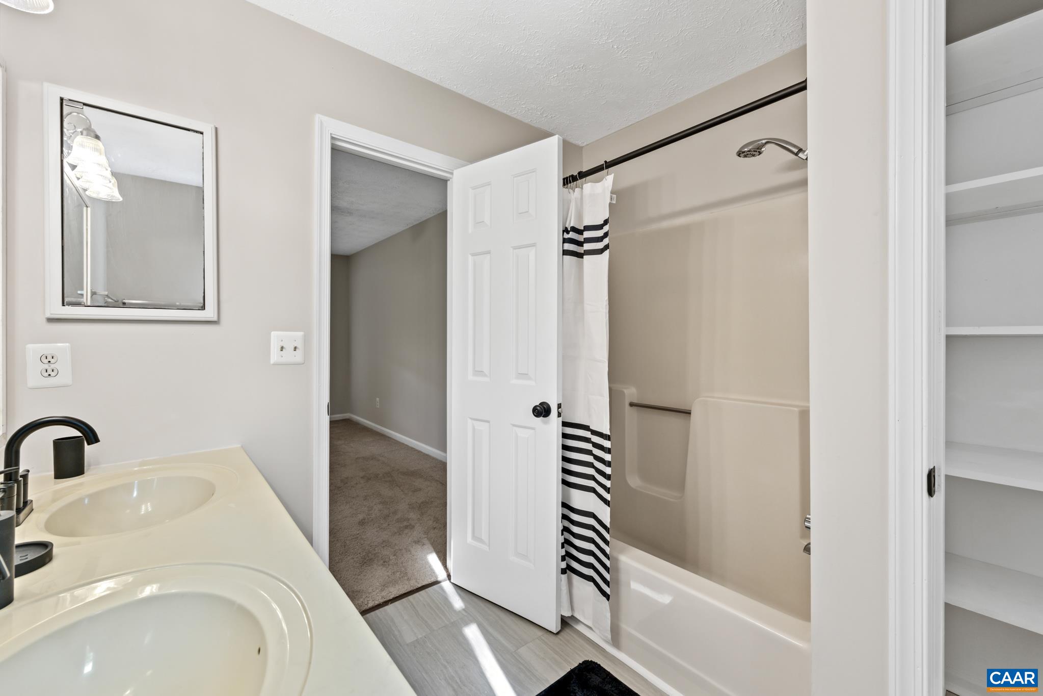 13259 Stonehouse Mountain Road Culpeper, VA 22701 - Photo 18 of 31 a bathroom with a sink a toilet and shower