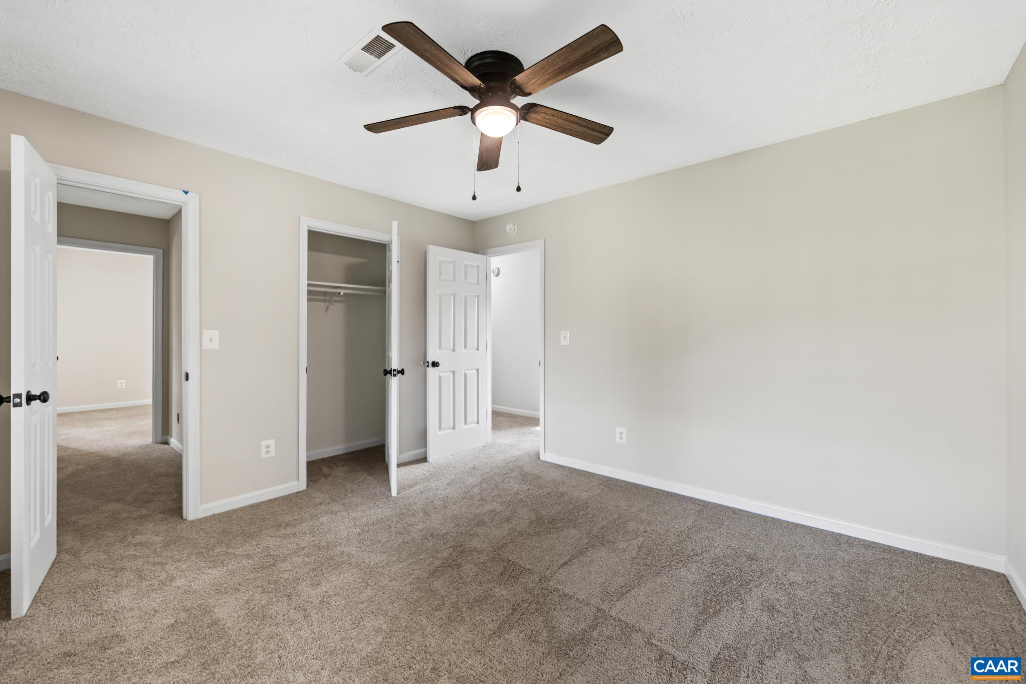 13259 Stonehouse Mountain Road Culpeper, VA 22701 - Photo 21 of 31 an empty room with chandelier fan