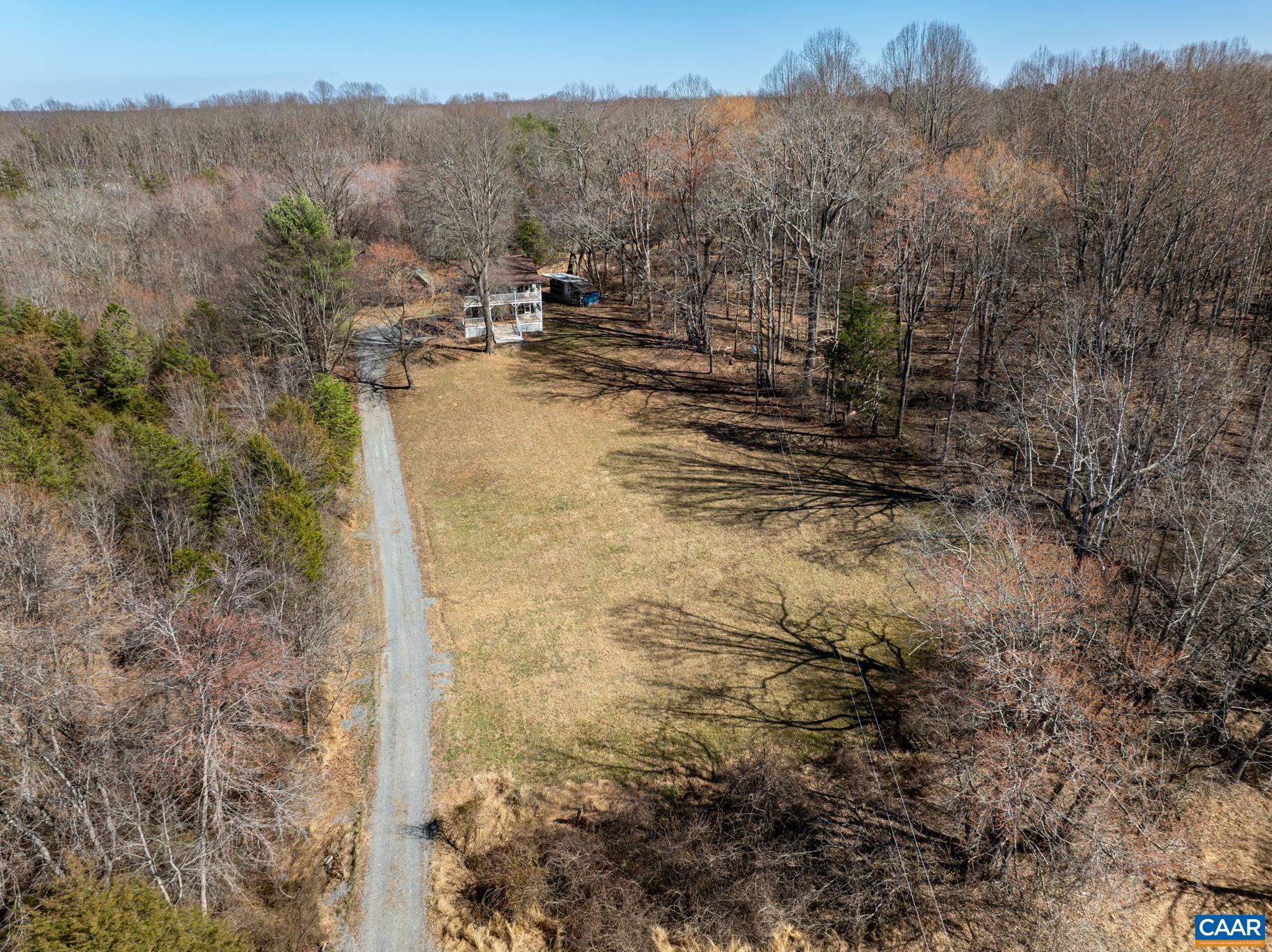 13259 Stonehouse Mountain Road Culpeper, VA 22701 - Photo 3 of 31 a view of a backyard of the house