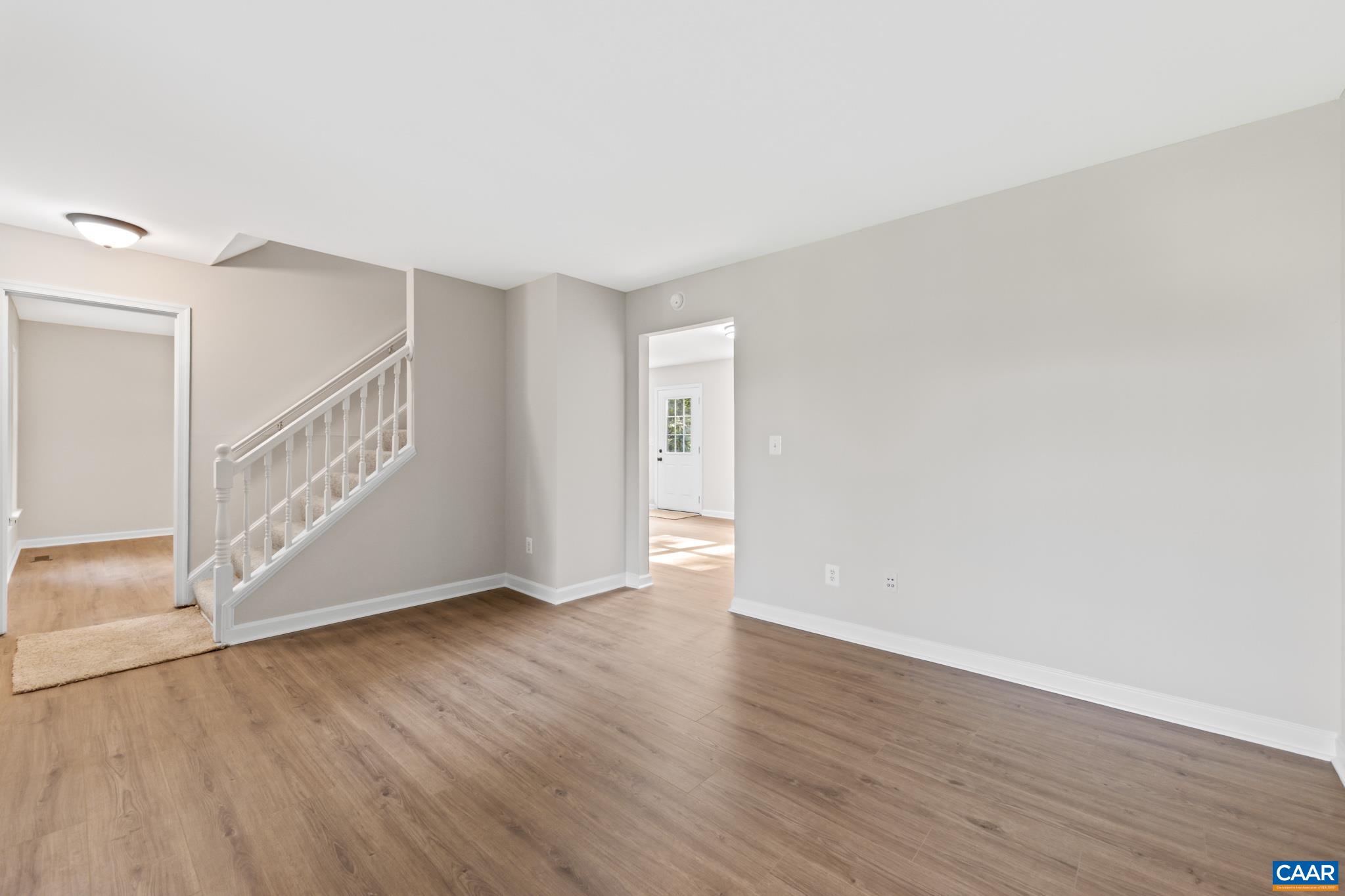 13259 Stonehouse Mountain Road Culpeper, VA 22701 - Photo 6 of 31 a view of an empty room with wooden floor