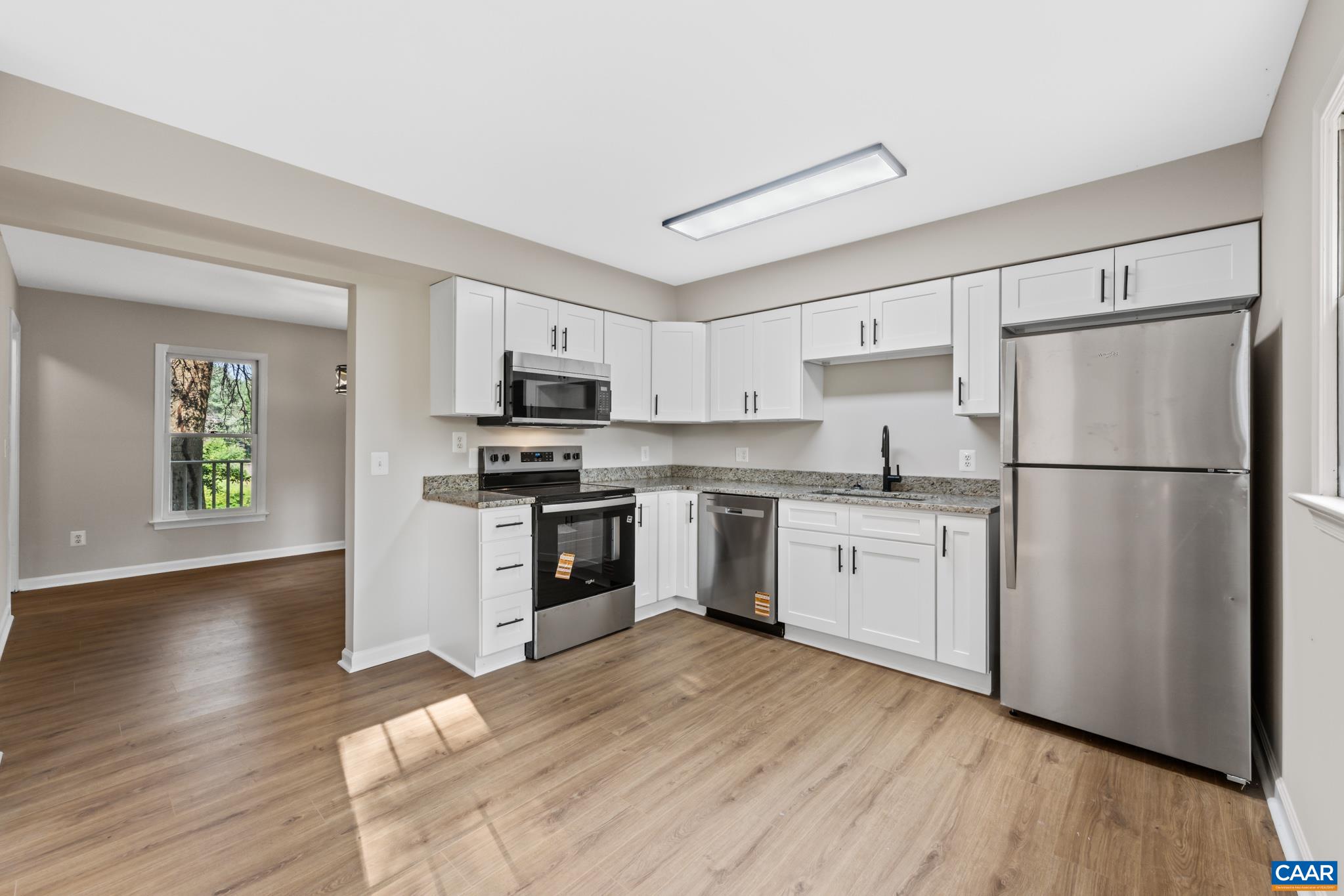 13259 Stonehouse Mountain Road Culpeper, VA 22701 - Photo 9 of 31 a kitchen with granite countertop stainless steel appliances a refrigerator stove top oven and sink