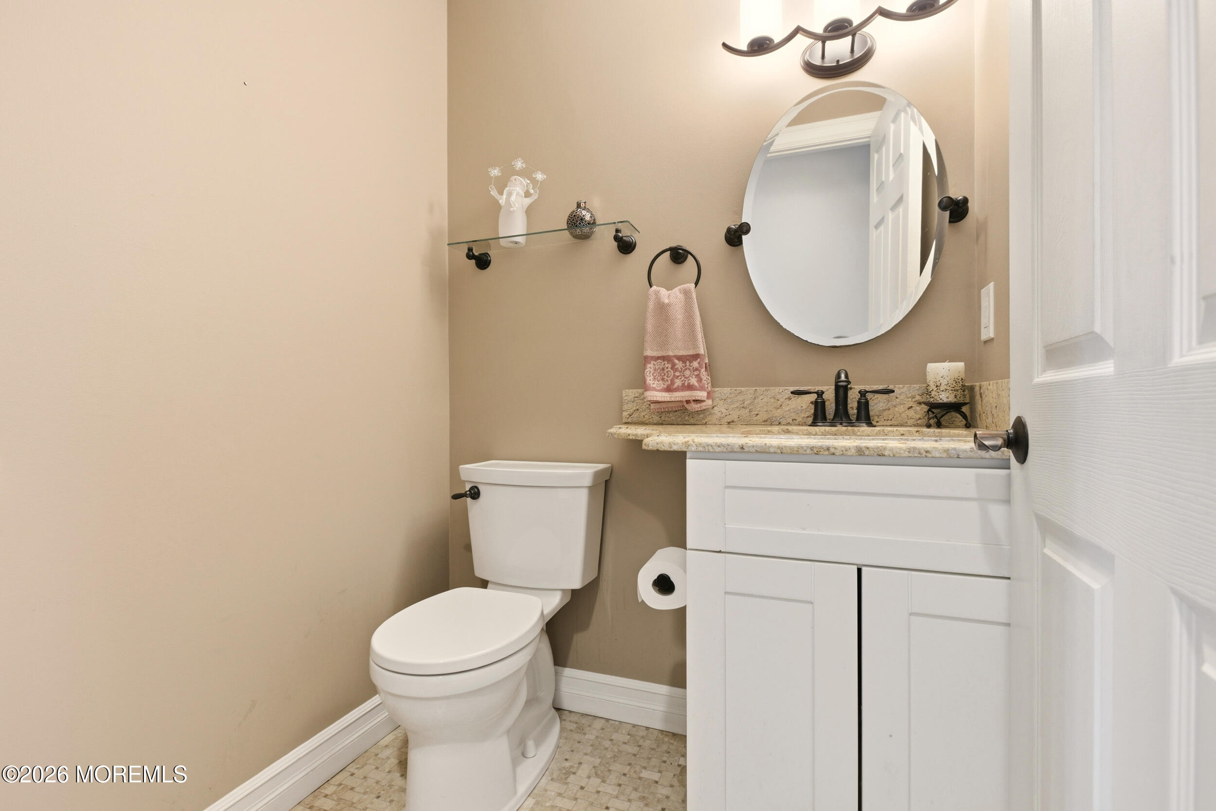 3 Arrowhead Circle Jackson, NJ 08527 - Photo 18 of 34 a bathroom with a toilet a sink and a mirror