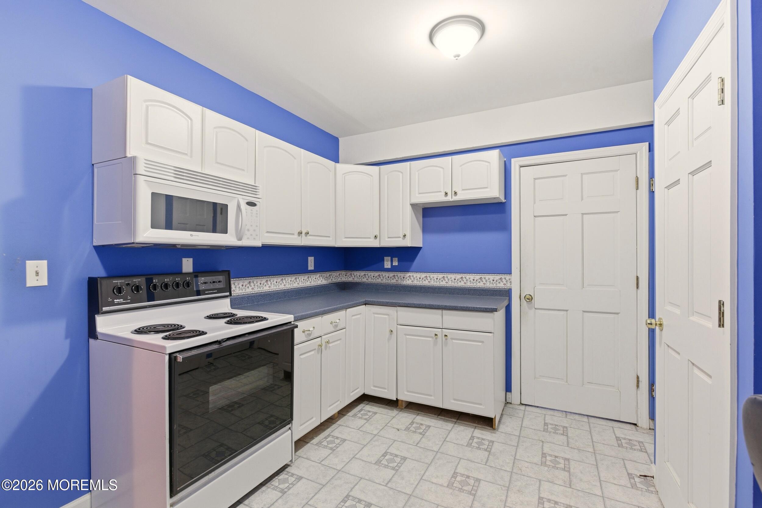 3 Arrowhead Circle Jackson, NJ 08527 - Photo 29 of 34 a kitchen with stainless steel appliances granite countertop a stove sink and cabinets