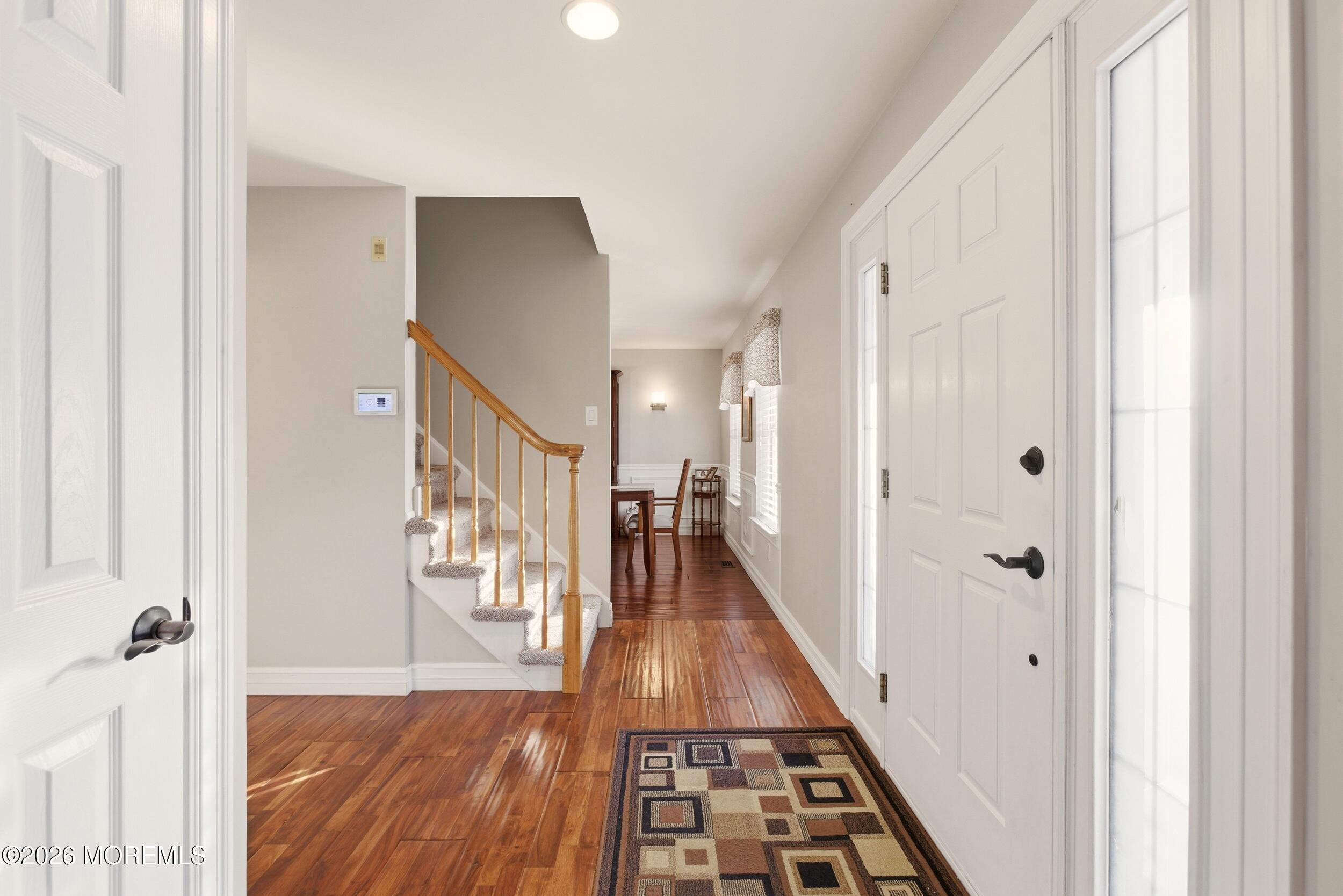 3 Arrowhead Circle Jackson, NJ 08527 - Photo 7 of 34 a view of a hallway with wooden floor and staircase