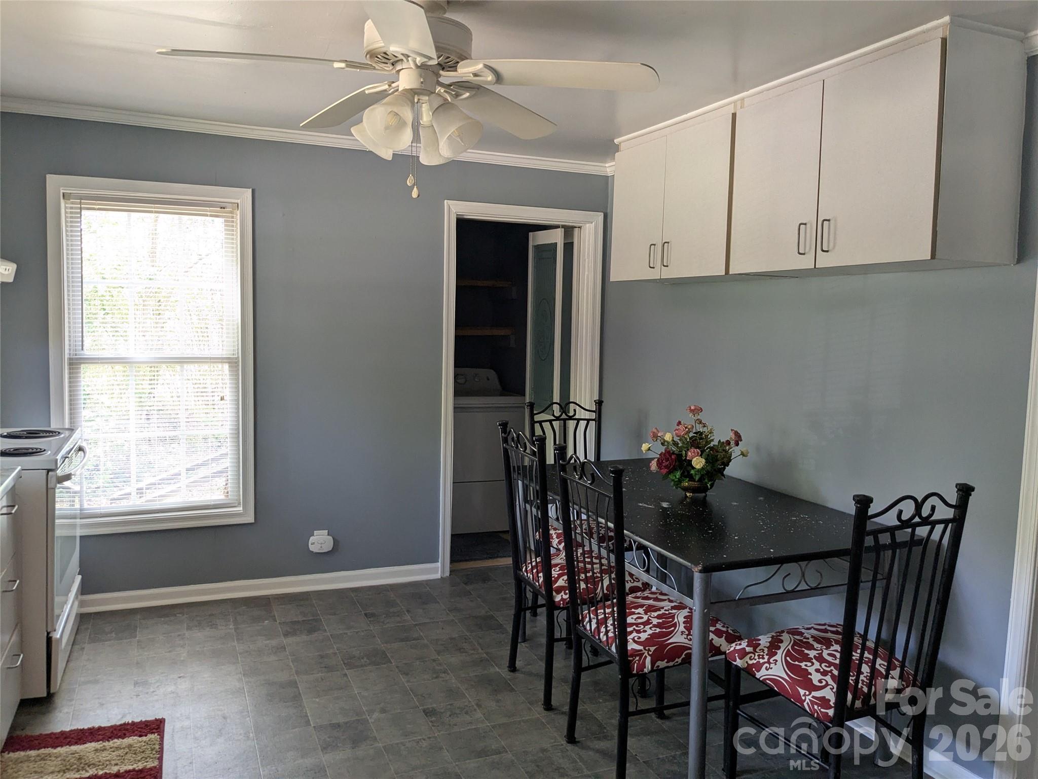 207 Morris Street Kings Mountain, NC 28086 - Photo 5 of 9 a view of a dining room with furniture and chandelier