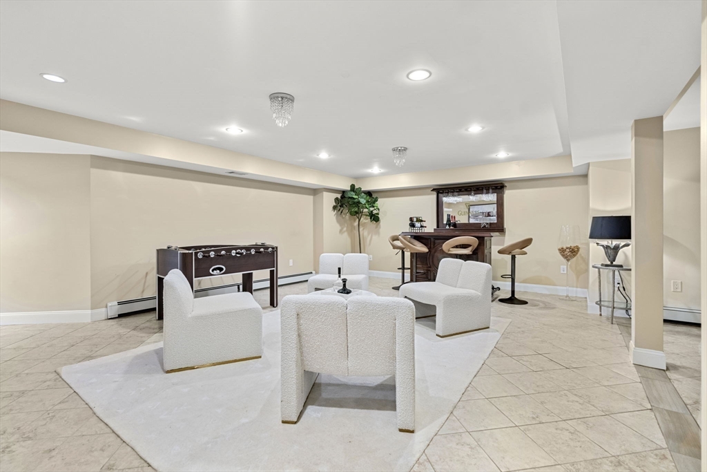 22 Scotney Road Newton, MA 02467 - Photo 36 of 42 a living room with furniture white walls and white walls