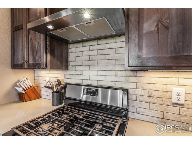 a kitchen with a stove and cabinets