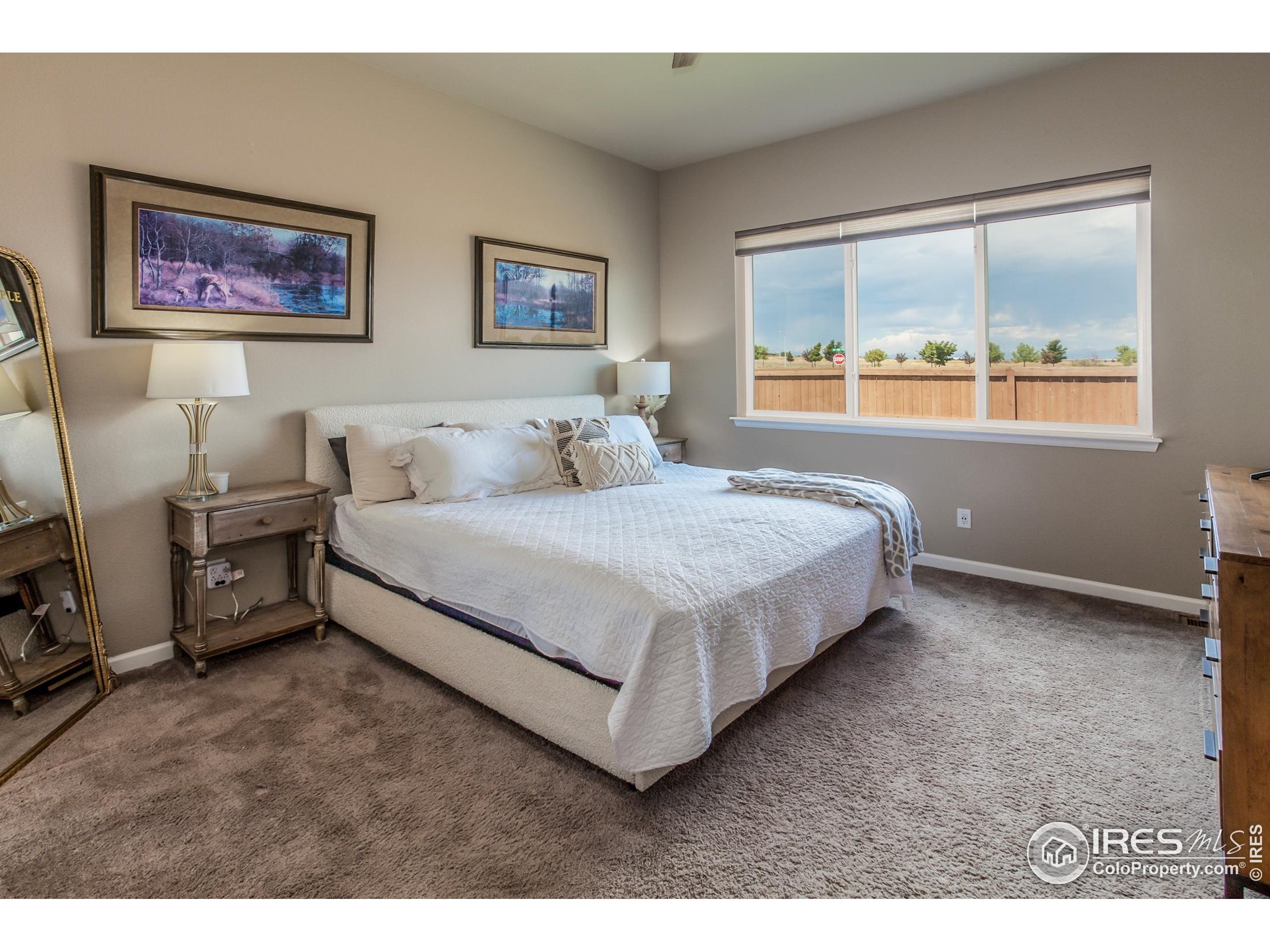 1231 105th Avenue Greeley, CO 80634 - Photo 26 of 43 a living room with furniture and a window