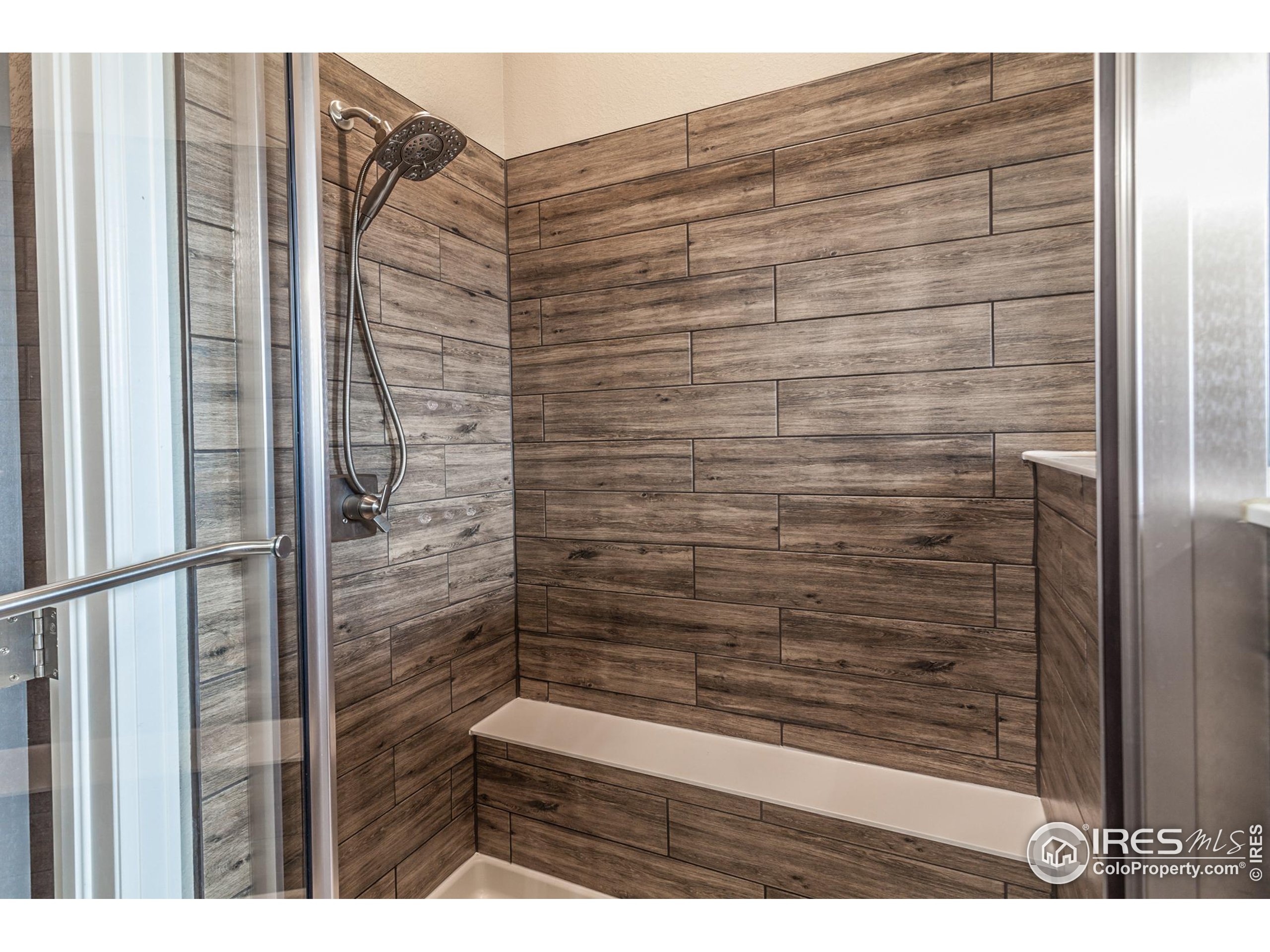 1231 105th Avenue Greeley, CO 80634 - Photo 30 of 43 a bathroom with a shower