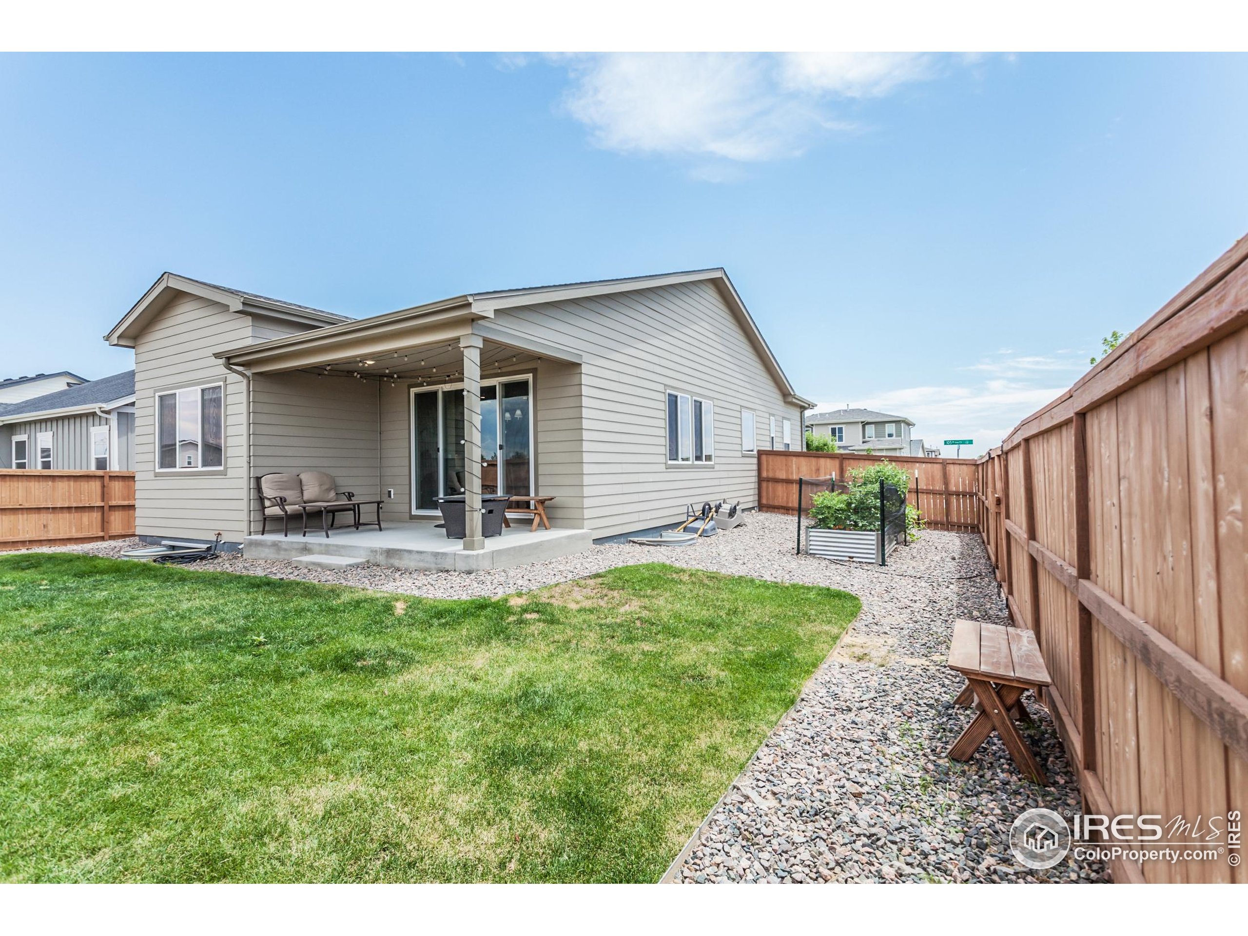 1231 105th Avenue Greeley, CO 80634 - Photo 38 of 43 a backyard of a house with table and chairs
