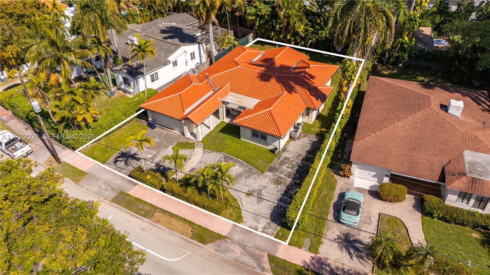 4555 Alton Road Miami Beach, FL 33140 - Photo 1 of 34 an aerial view of a house with a garden